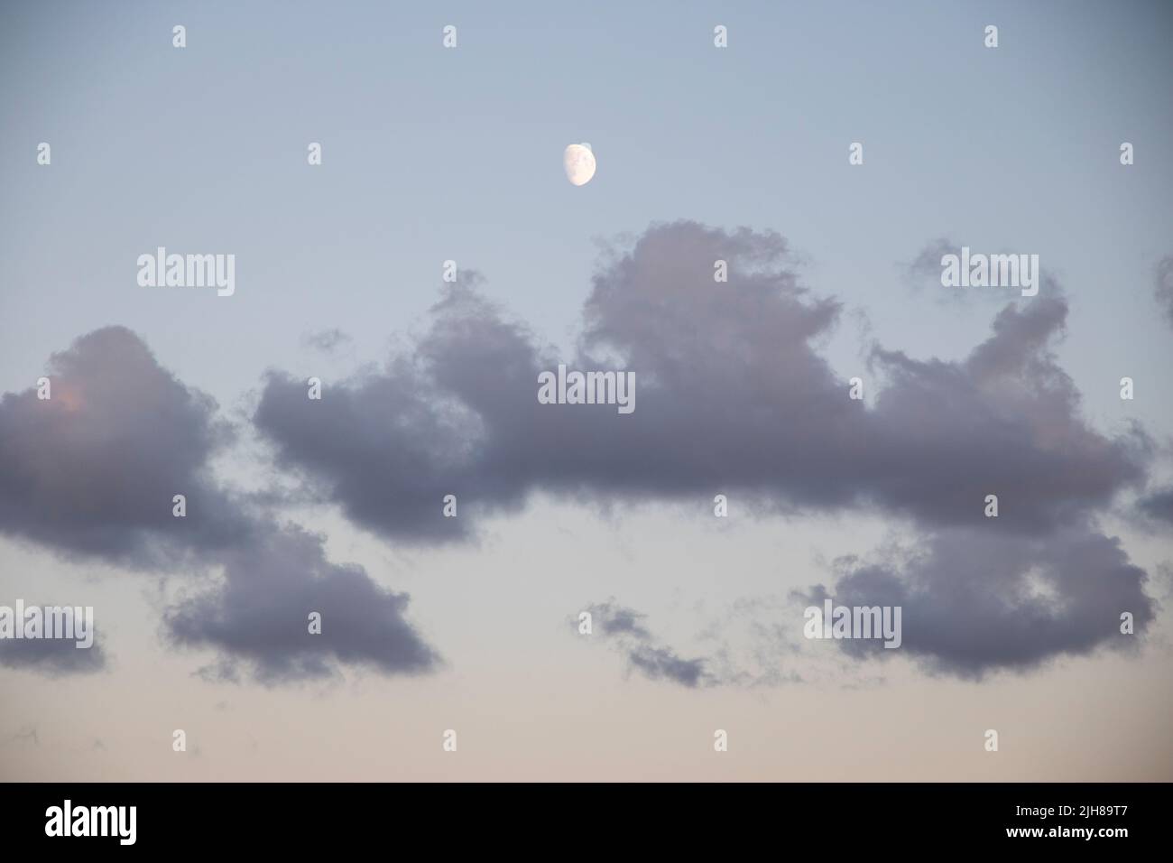 Clouds during sunset on a beach Stock Photo