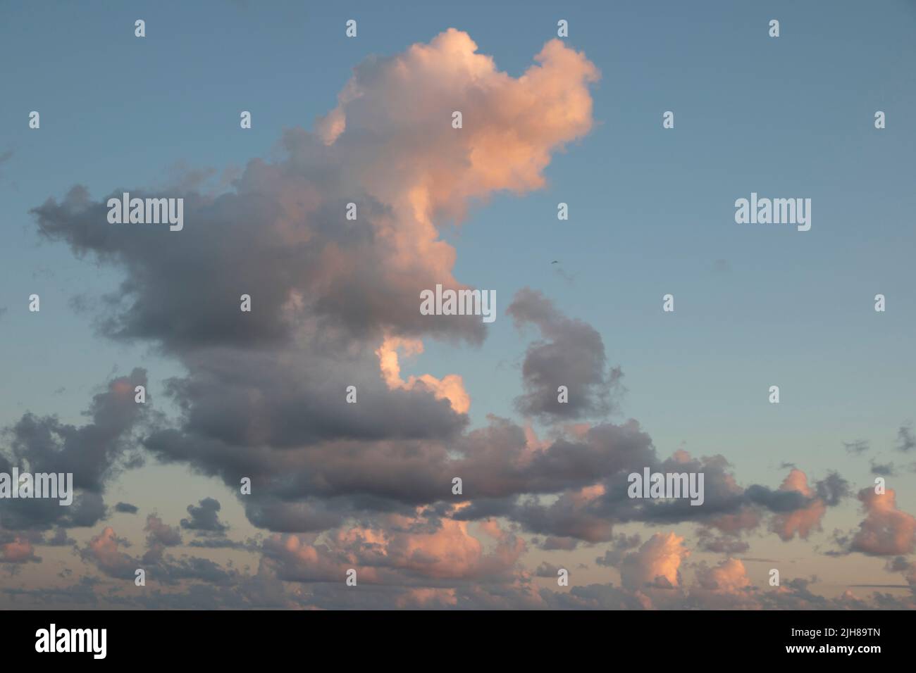 Clouds during sunset on a beach Stock Photo