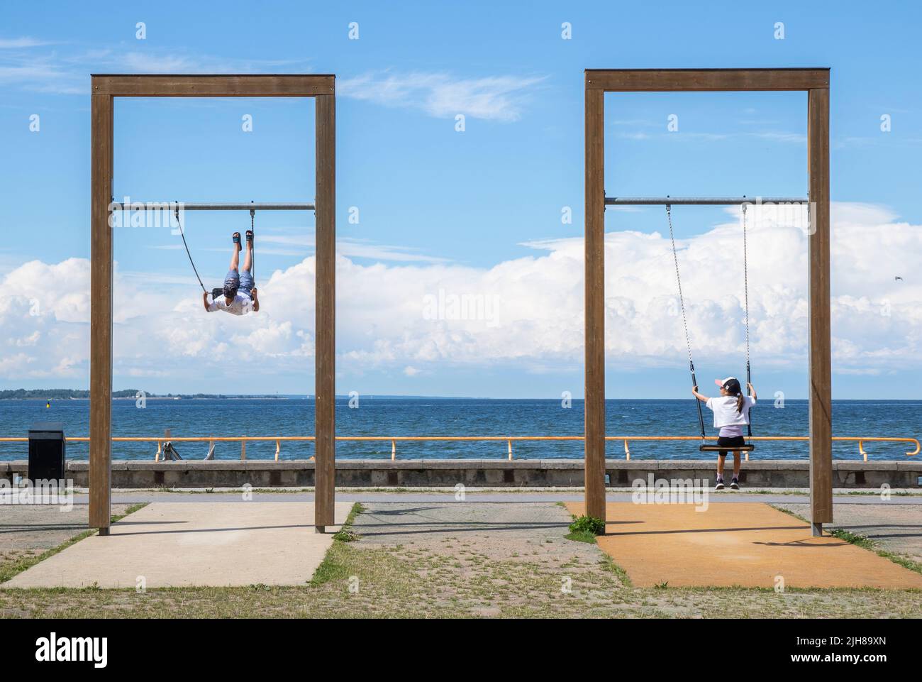 Kids swinging in Tallinn, Estonia Stock Photo