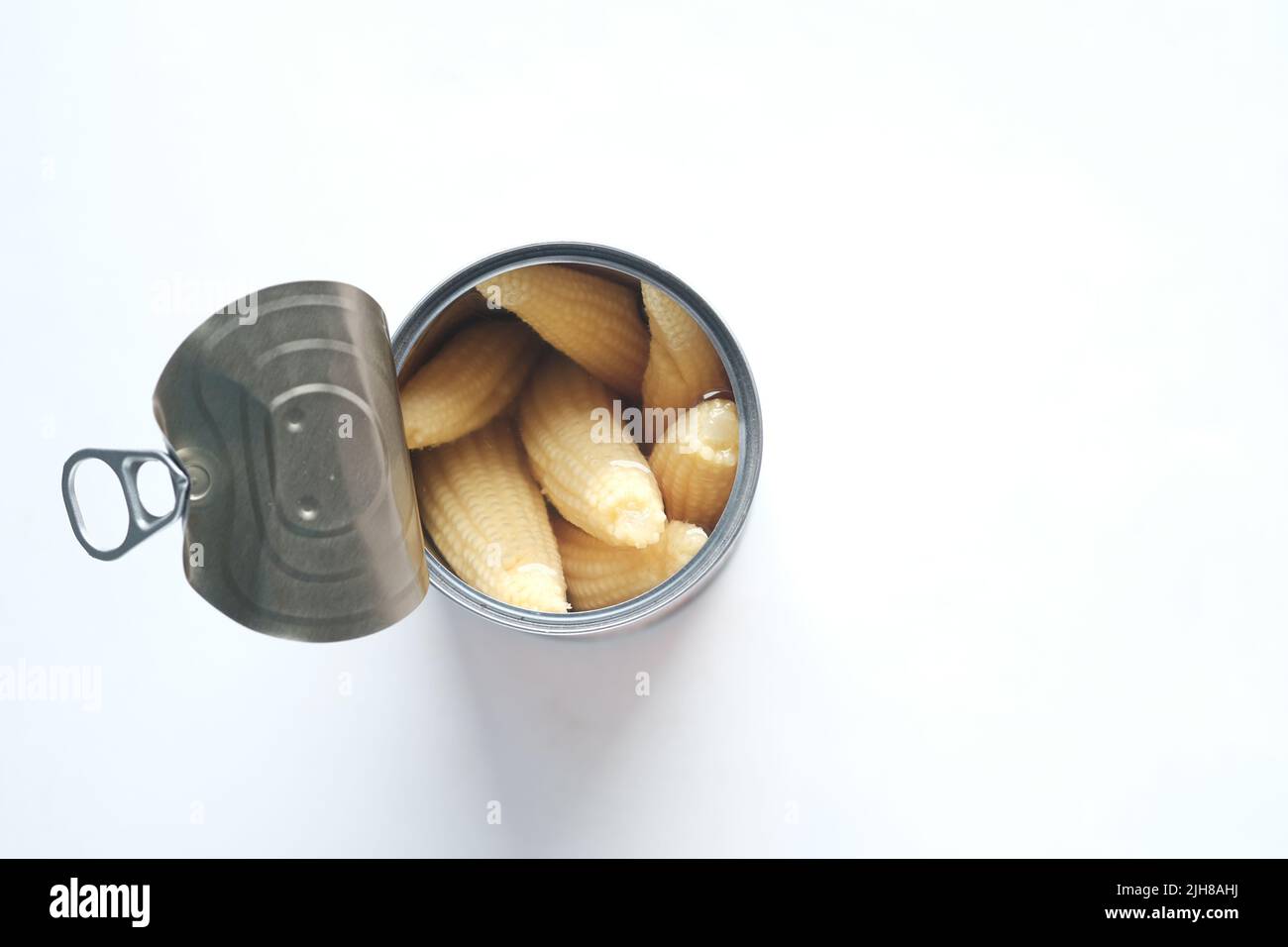 baby corn in a tin can container on white background  Stock Photo