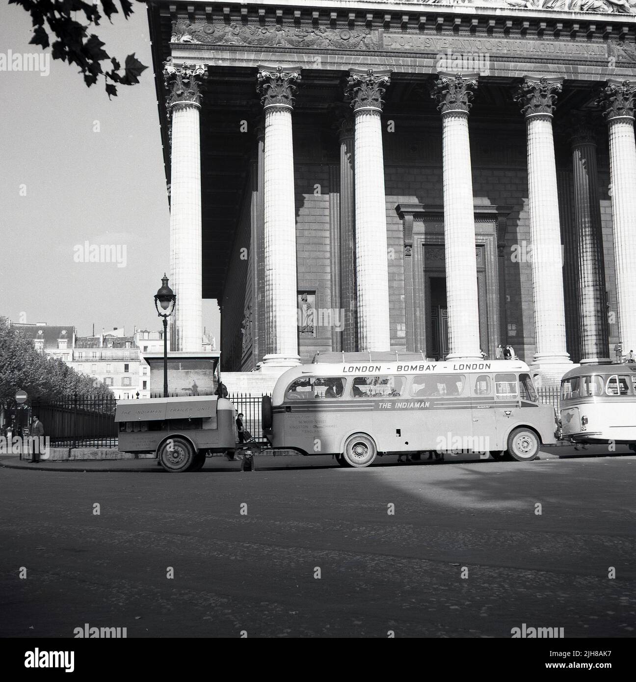 1960, summertime and the trans-continental bus 'The Indiaman', parked outside the Assemblee Nationale, Paris, France. Passengers went from London to Bombay in India and back to London, organised by Garrow-Fisher Tours of Kingston Upon Thames, England, UK. At the rear of the vehicle, a refurbished 1948 AEC Regal III, for 24 passengers, a trailer Unit. The Indiaman was the first bus connecting London and south Asia, starting in 1957 with a service from London to Calcutta. Political unrest in the Middle East eventually made such routes difficult and they ended in 1979. Stock Photo