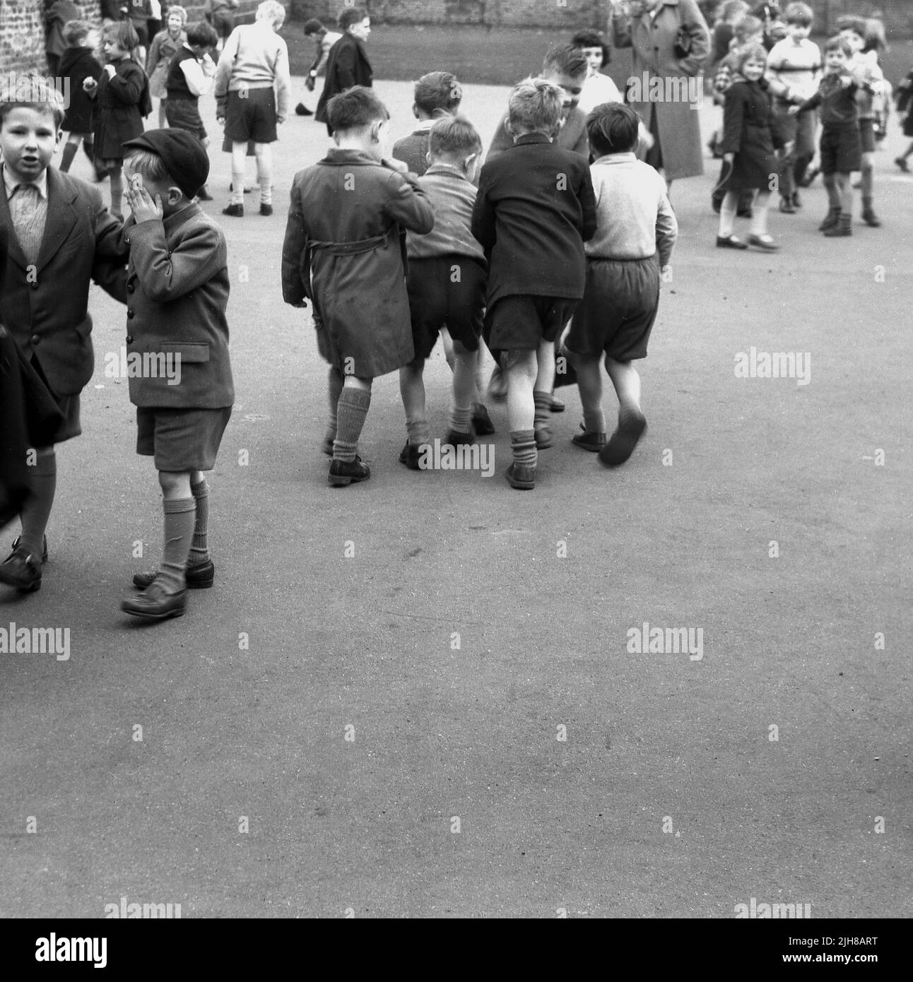 1960s, historical, primary school playground, young children outside