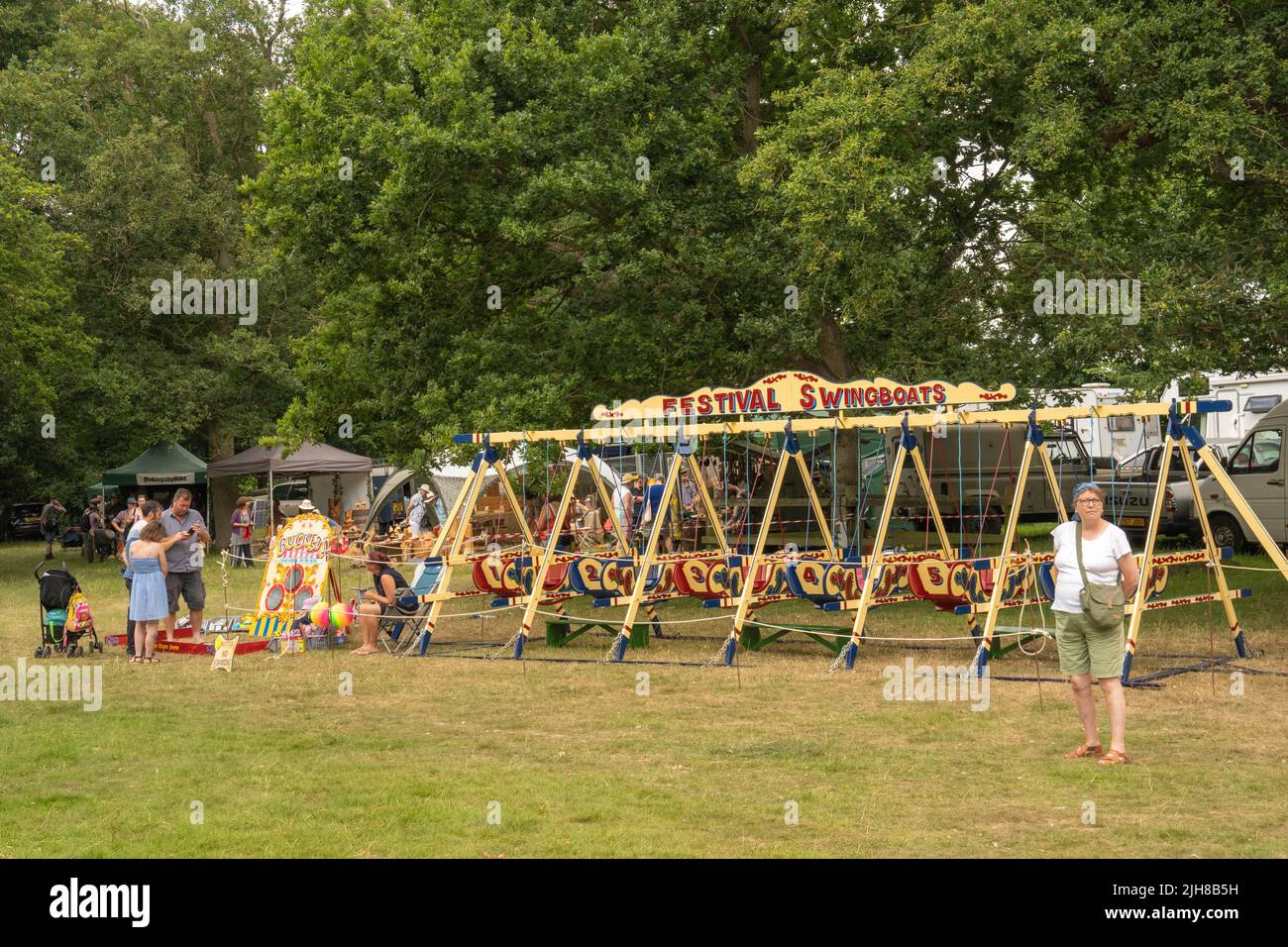 old style swing boats ride at Strumpshaw tree fair Norfolk England UK
