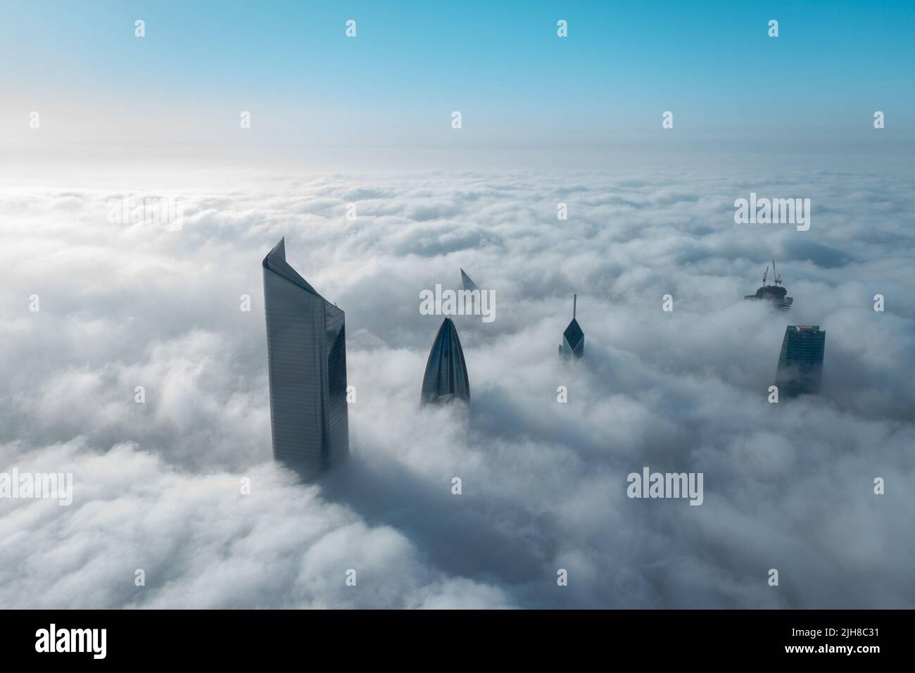 A high tall building in Kuwait city covered with fog Stock Photo Alamy