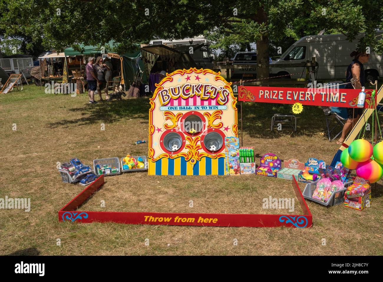 traditional old style fair game of throw a ball in a bucket to win
