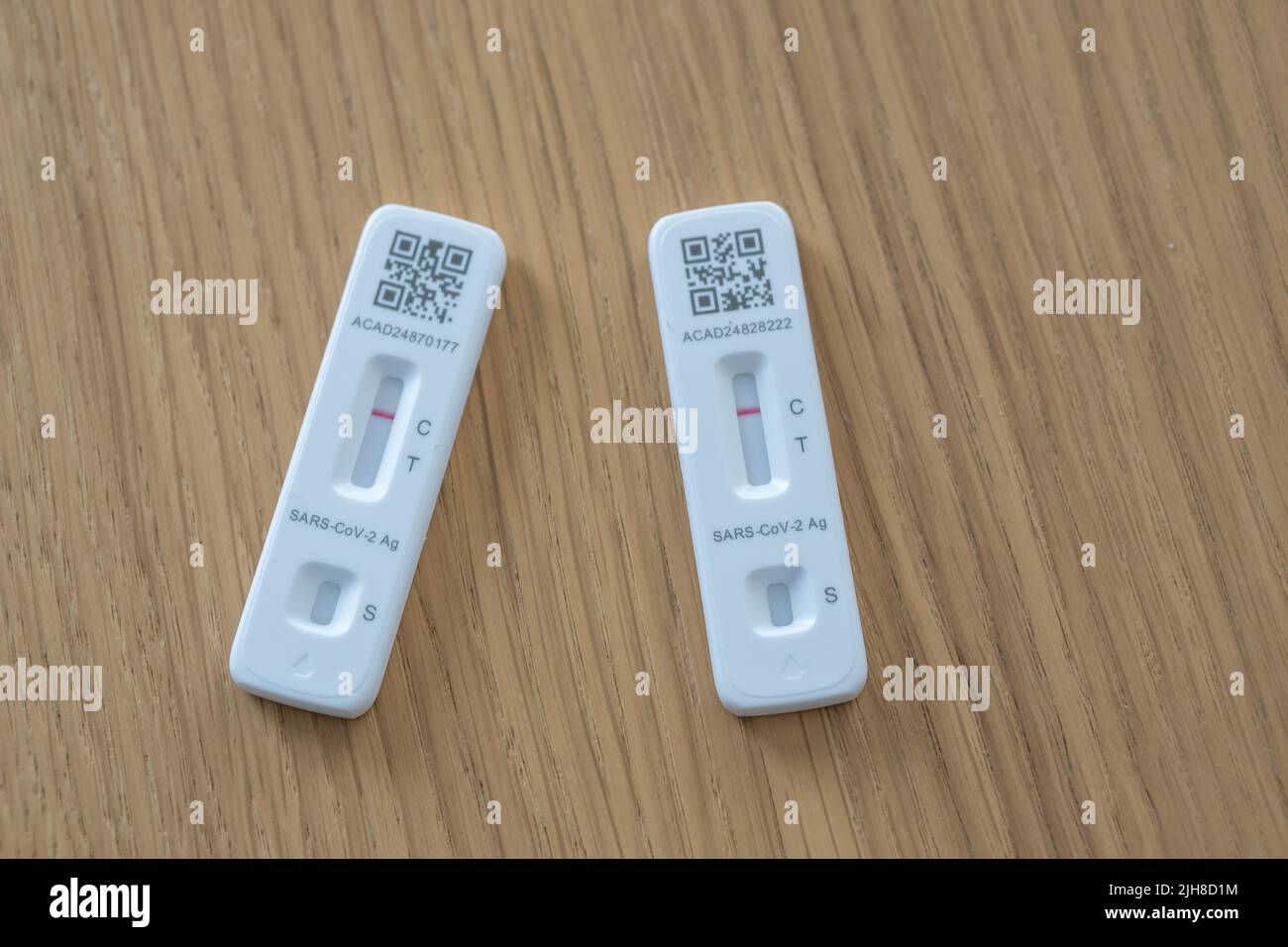 A top view of two Covid19 rapid tests of Flowflex brand with a barcode