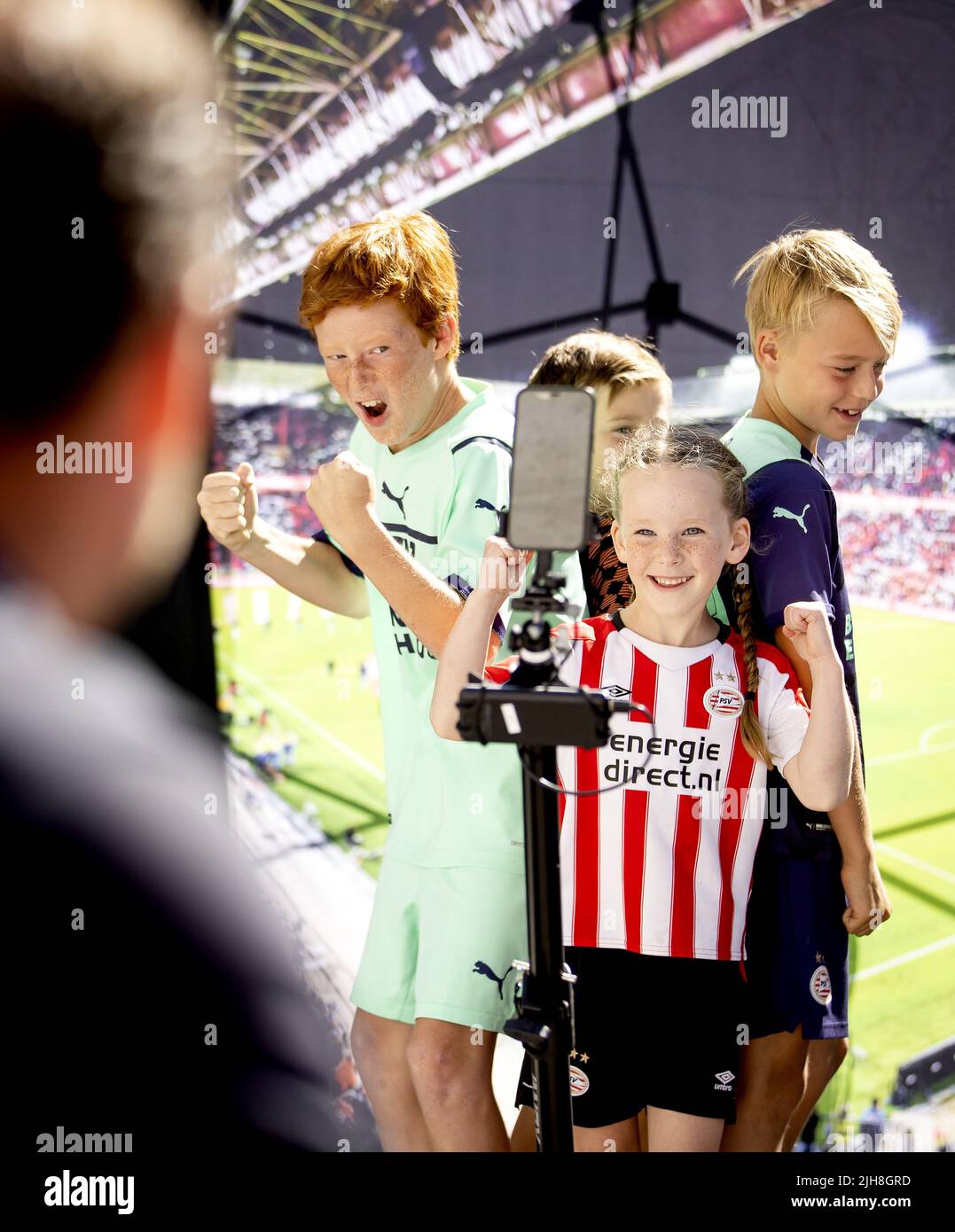 EINDHOVEN - PSV supporters during the annual PSV Fan Day at the Philips Stadium. After two years, the event can continue for fans. There is, among other things, a Walk of Fame where famous PSV players are assigned a place during the tile ceremony. KOEN VAN WEEL Stock Photo