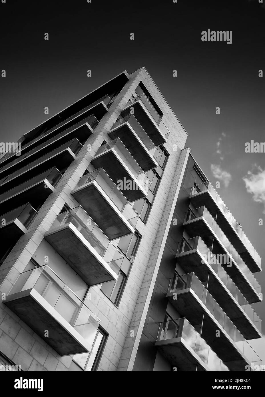 A low-angle grayscale shot of new apartment blocks in Helsingborg Stock Photo