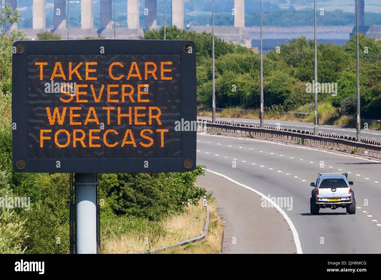 ROGIET, WALES - JULY 16: A sign on the M4 near the Prince of Wales Bridge warns motorists to take care due to the severe weather forecast on July 16, Stock Photo