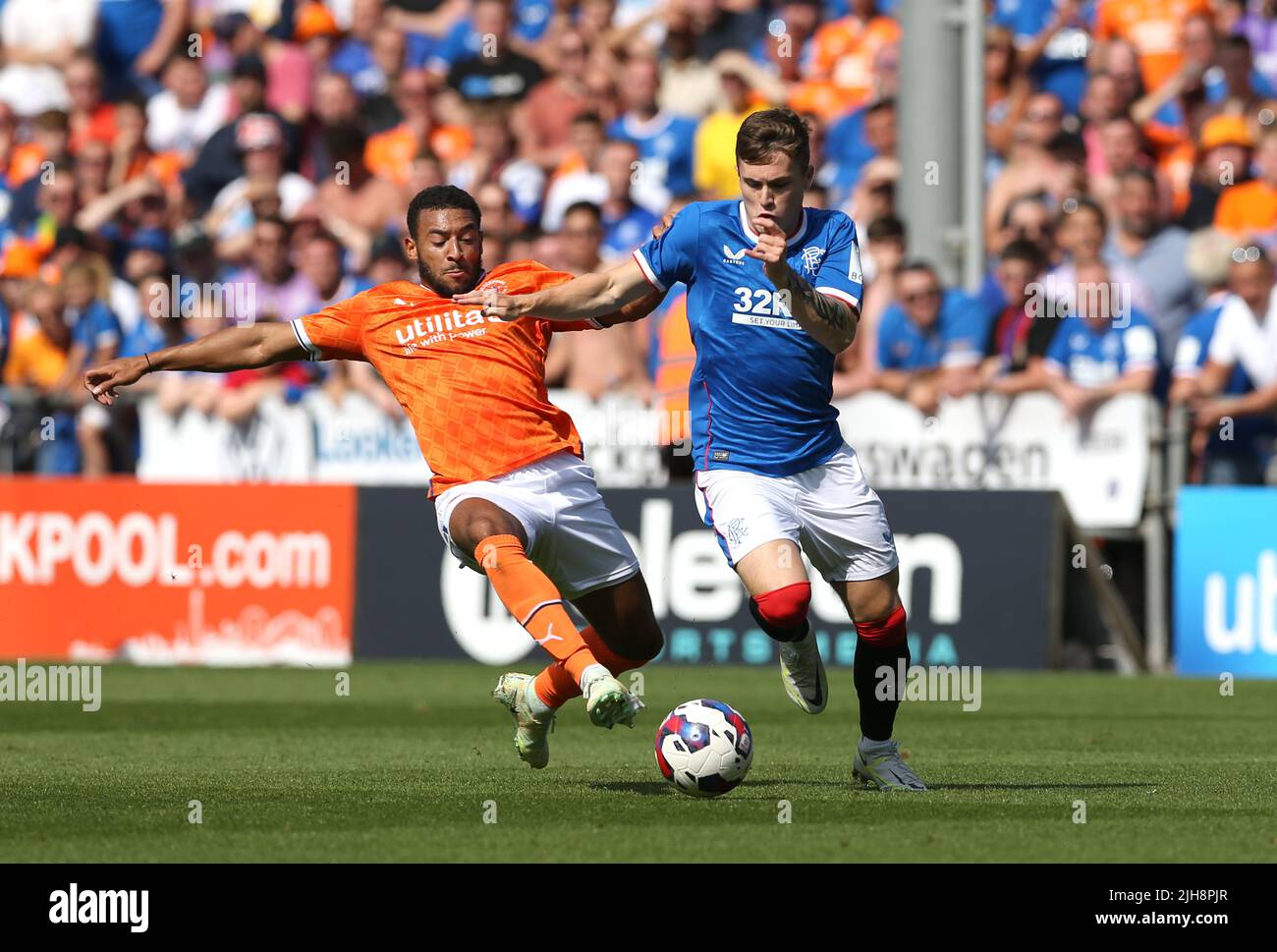 Rangers' Charlie McCann (right) and Blackpool's Keshi Anderson battle
