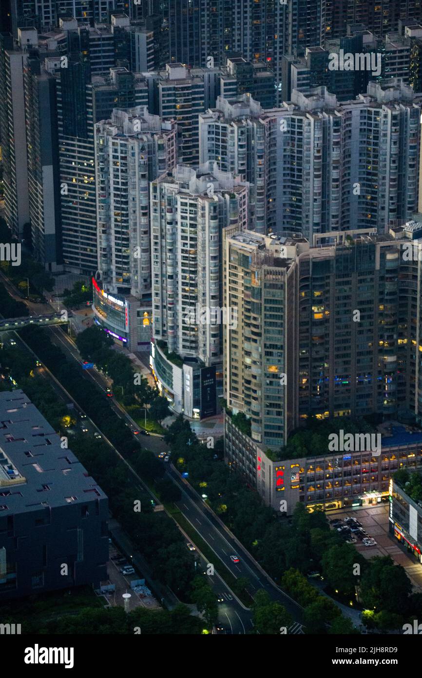 An aerial view of the busy street and high-raised buildings in a city ...