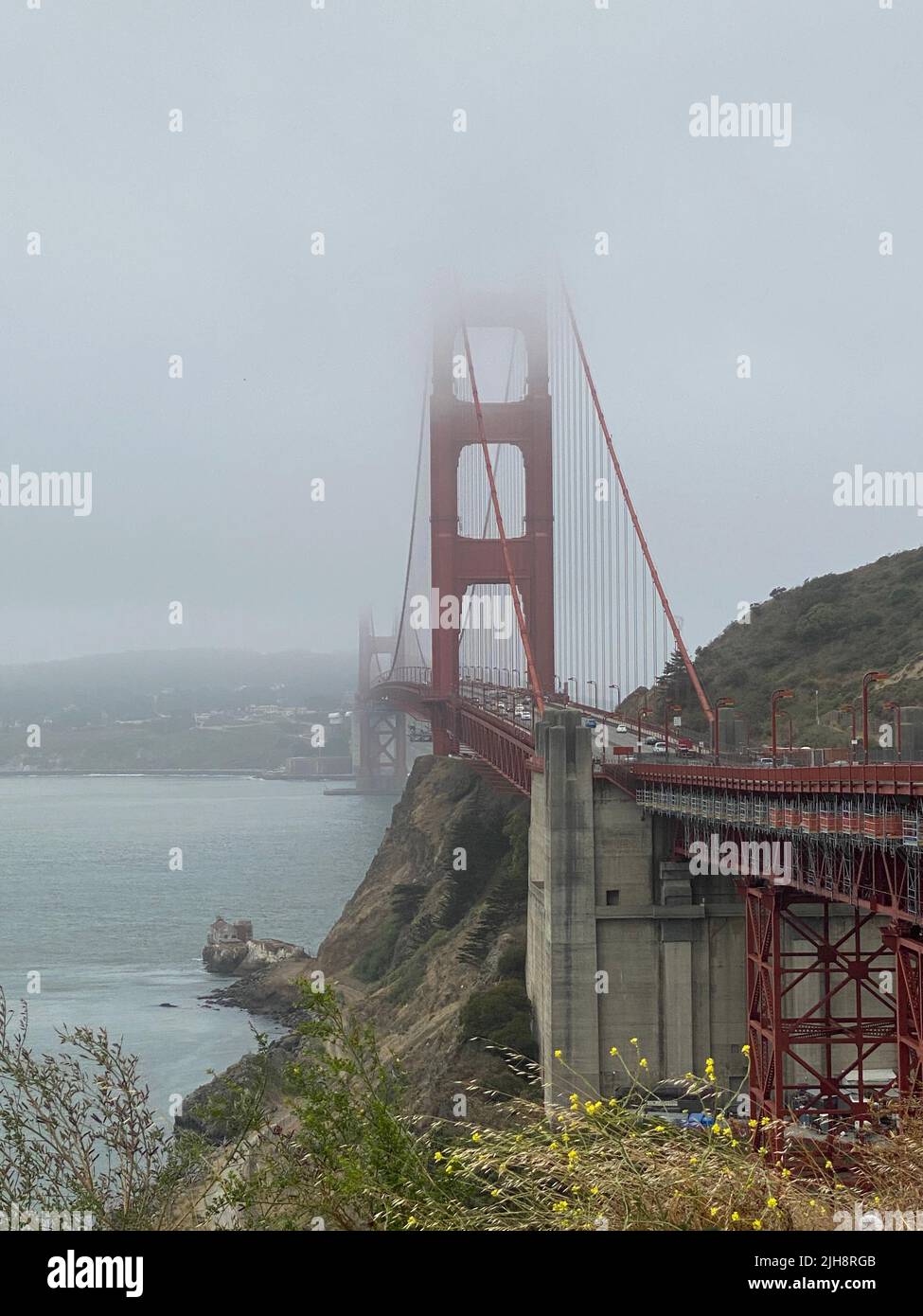 The Golden Gate bridge in a fog, vertical Stock Photo - Alamy