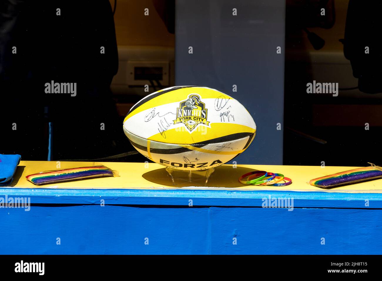 Signed York City Knights rugby ball in window of YO1 radio station. Stock Photo