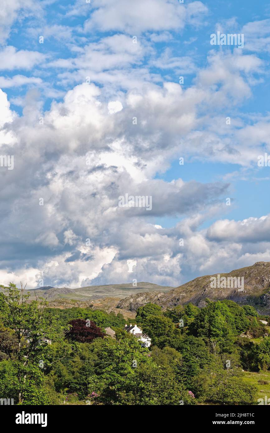 White cumulus clouds forming over the Eskdale valley on a sunny summers ...