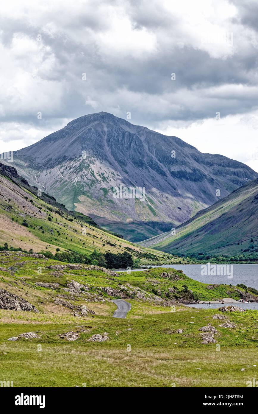 Great Gable mountain dominating the skyline as viewed from the western end of Wastwater Lake Wasdale Cumbria England UK Stock Photo