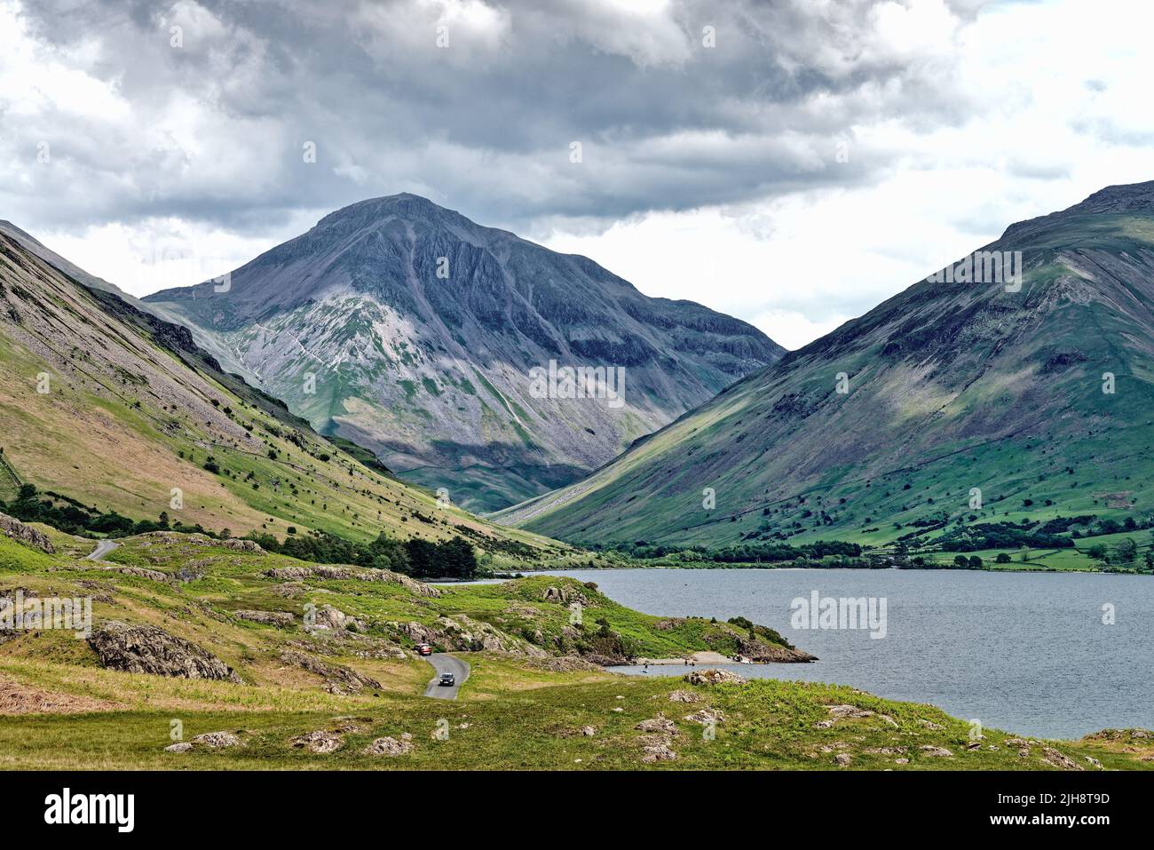 Great Gable mountain dominating the skyline as viewed from the western end of Wastwater Lake Wasdale Cumbria England UK Stock Photo