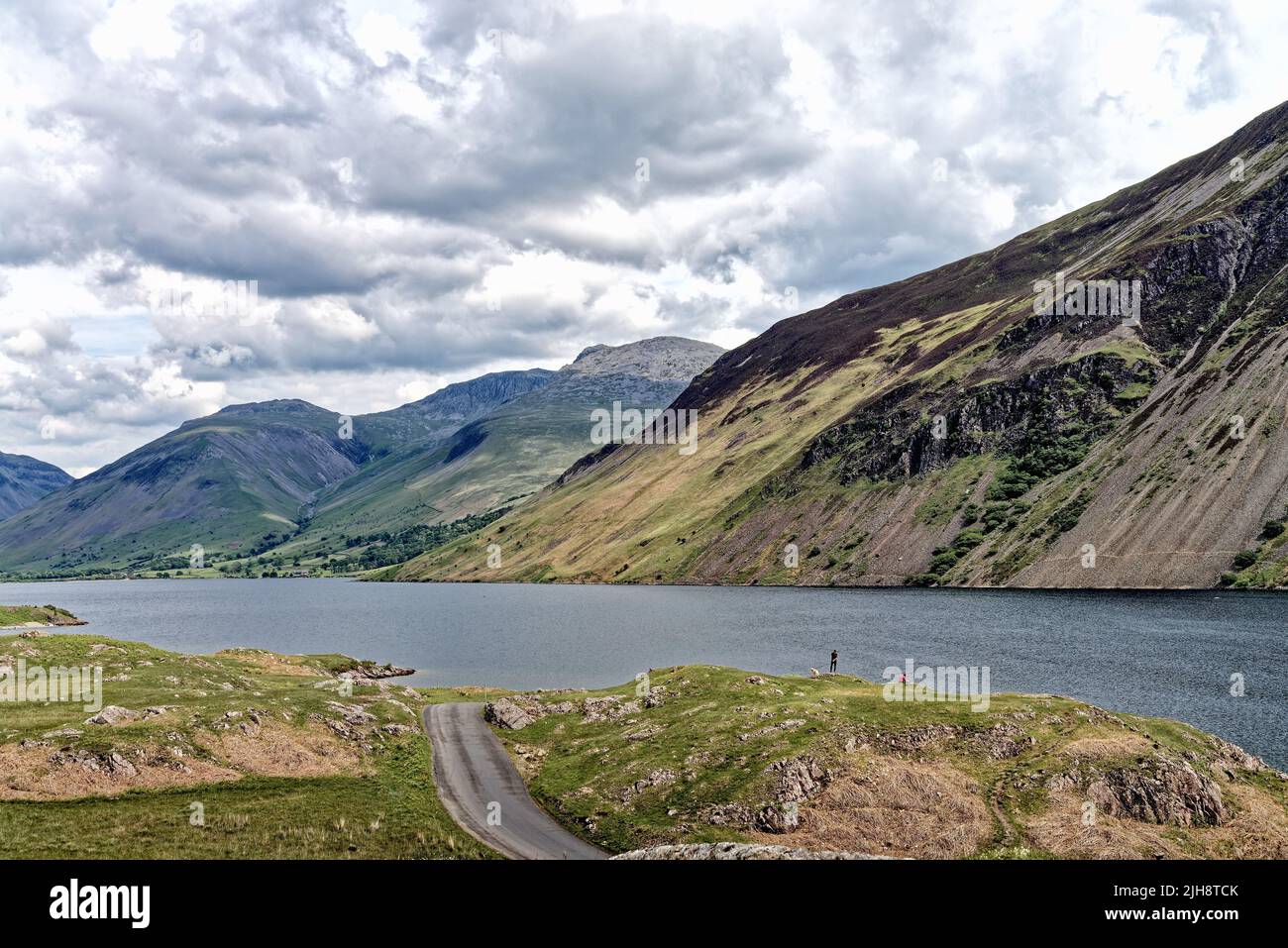 The dramatic view of Wastwater lake looking towards Wasdale Head and the surrounding mountains on a summers day Cumbria England UK Stock Photo
