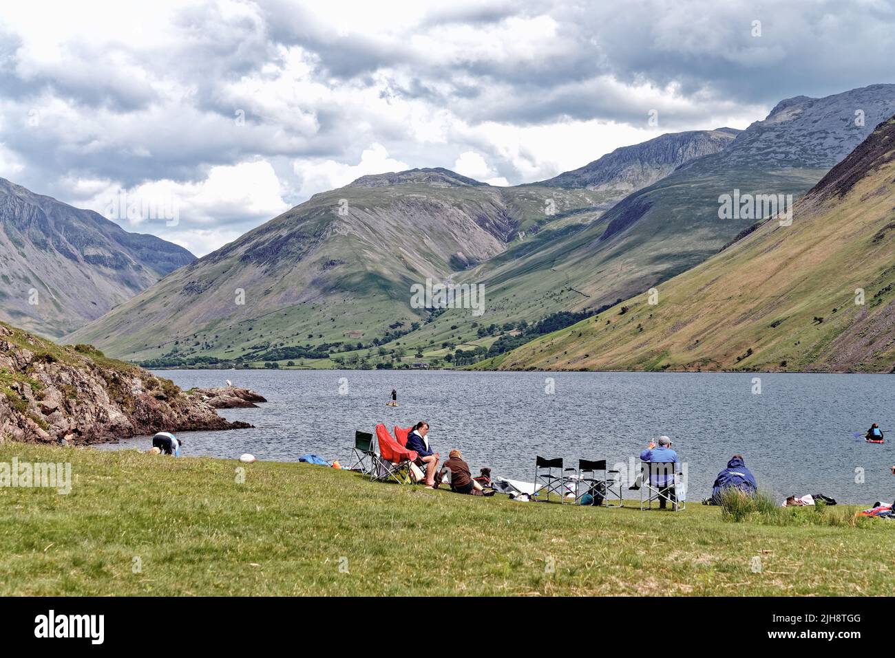 The dramatic view of Wastwater lake looking towards Wasdale Head and the surrounding mountains on a summers day Cumbria England UK Stock Photo