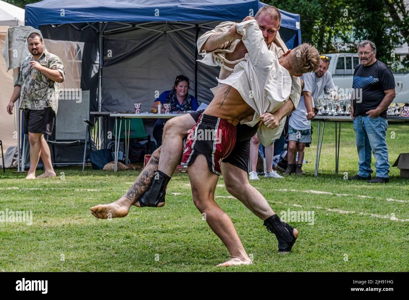 Newquay, Cornwall, UK. 16th Jul, 2020. Competitors in the first round of the Mens Open in the Grand Cornish Wrestling Tournament on the picturesque village green of St Mawgan in Pydar in Cornwall. Credit: Gordon Scammell/Alamy Live News Stock Photo