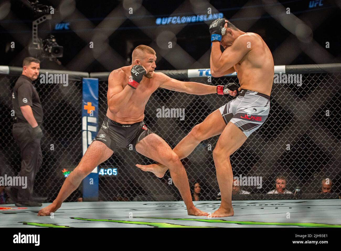 LONG ISLAND, NY JULY 16 (LR) Dustin Jacoby battles Jung Da Un in their Light Heavyweight