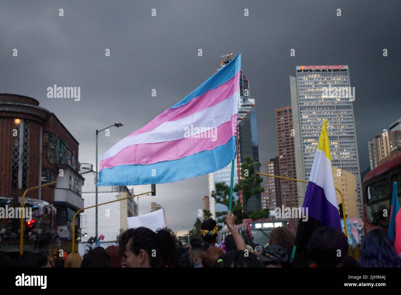 A demonstrators waves a trans community flag in the annual 'Yo Marcho