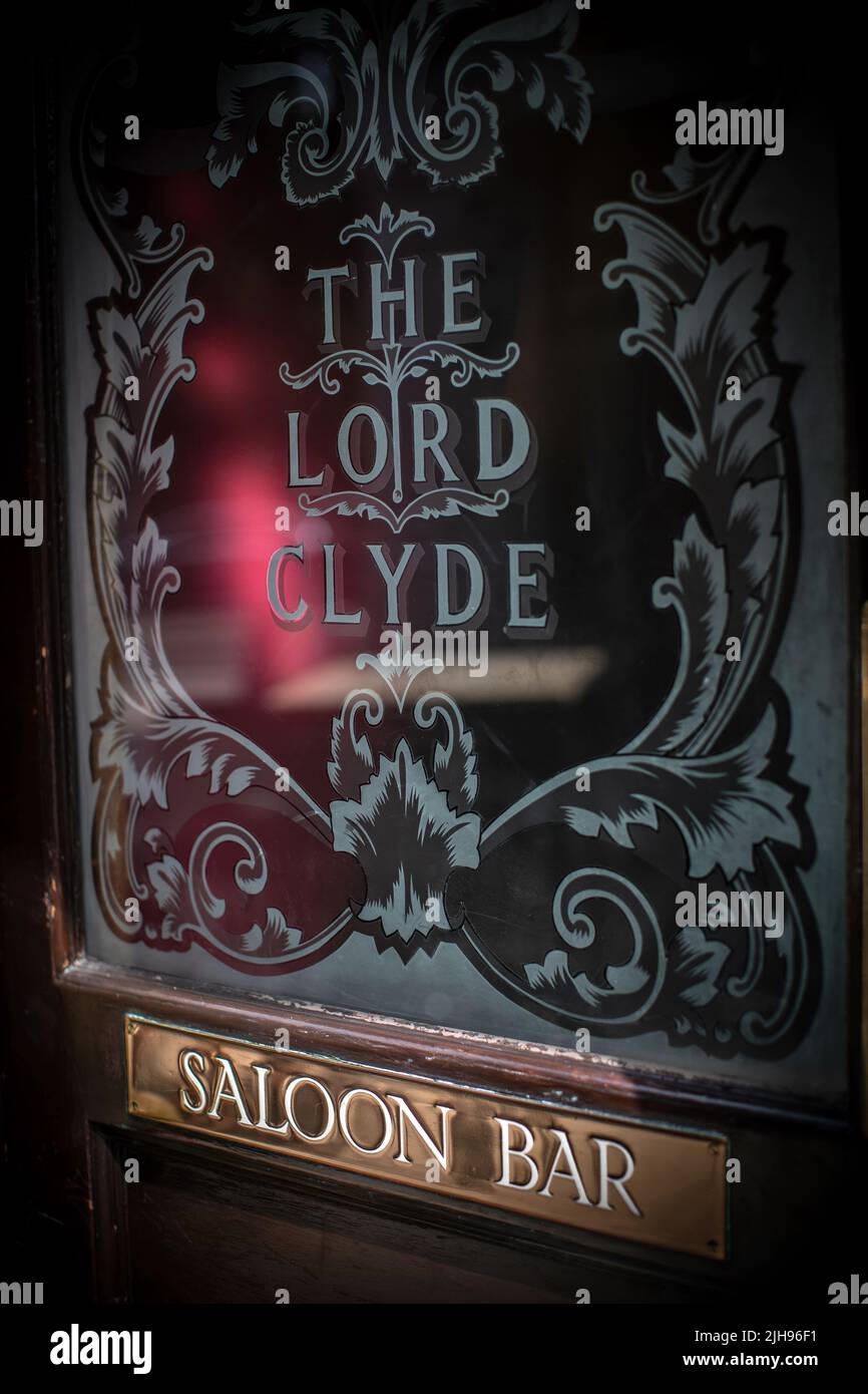 Door to the Public Bar of The Lord Clyde pub, Clennan Street, Southwark, London, England, UK Stock Photo
