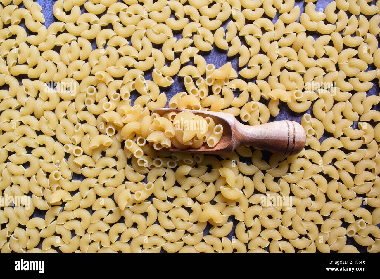 Raw whole dried ridged elbow macaroni pasta Stock Photo - Alamy
