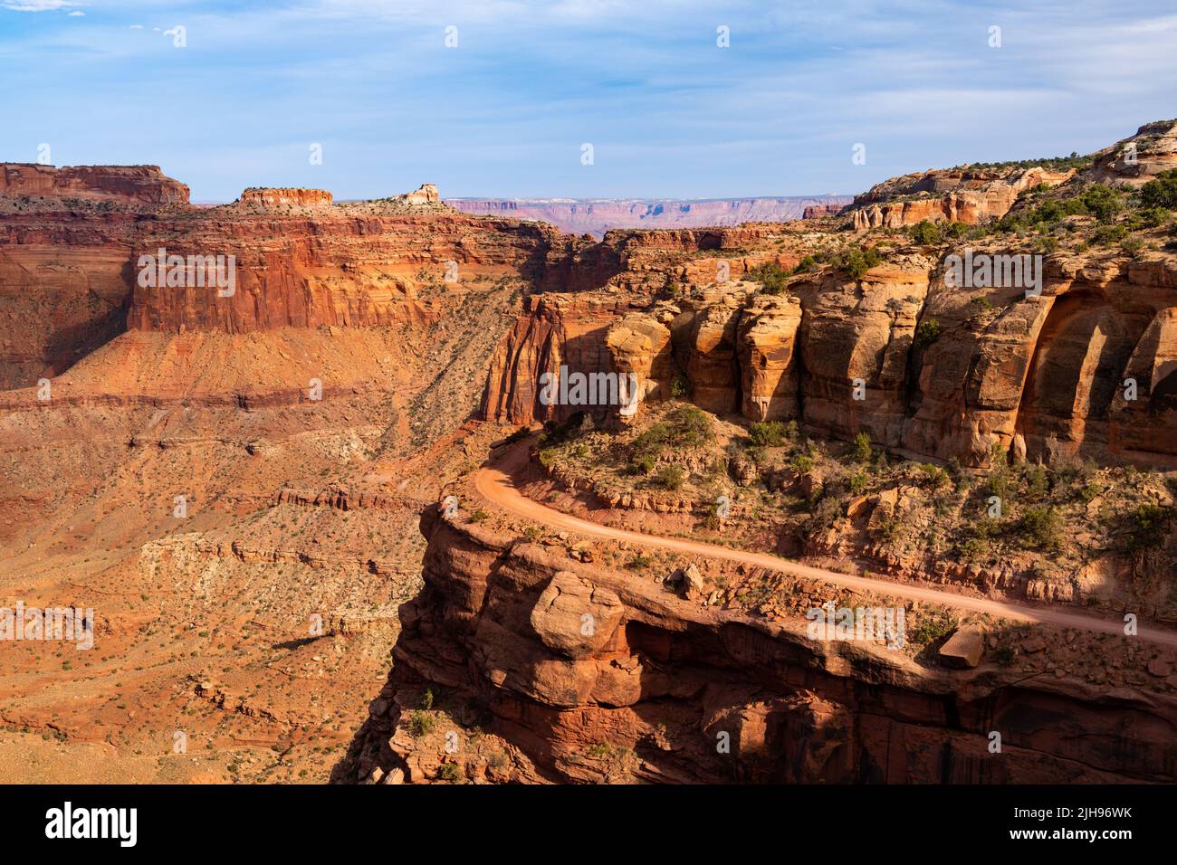 View of the 4WD Shafer Trail curving high above Shafer Canyon in the rugged landscape of Canyonlands National Park, Utah Stock Photo