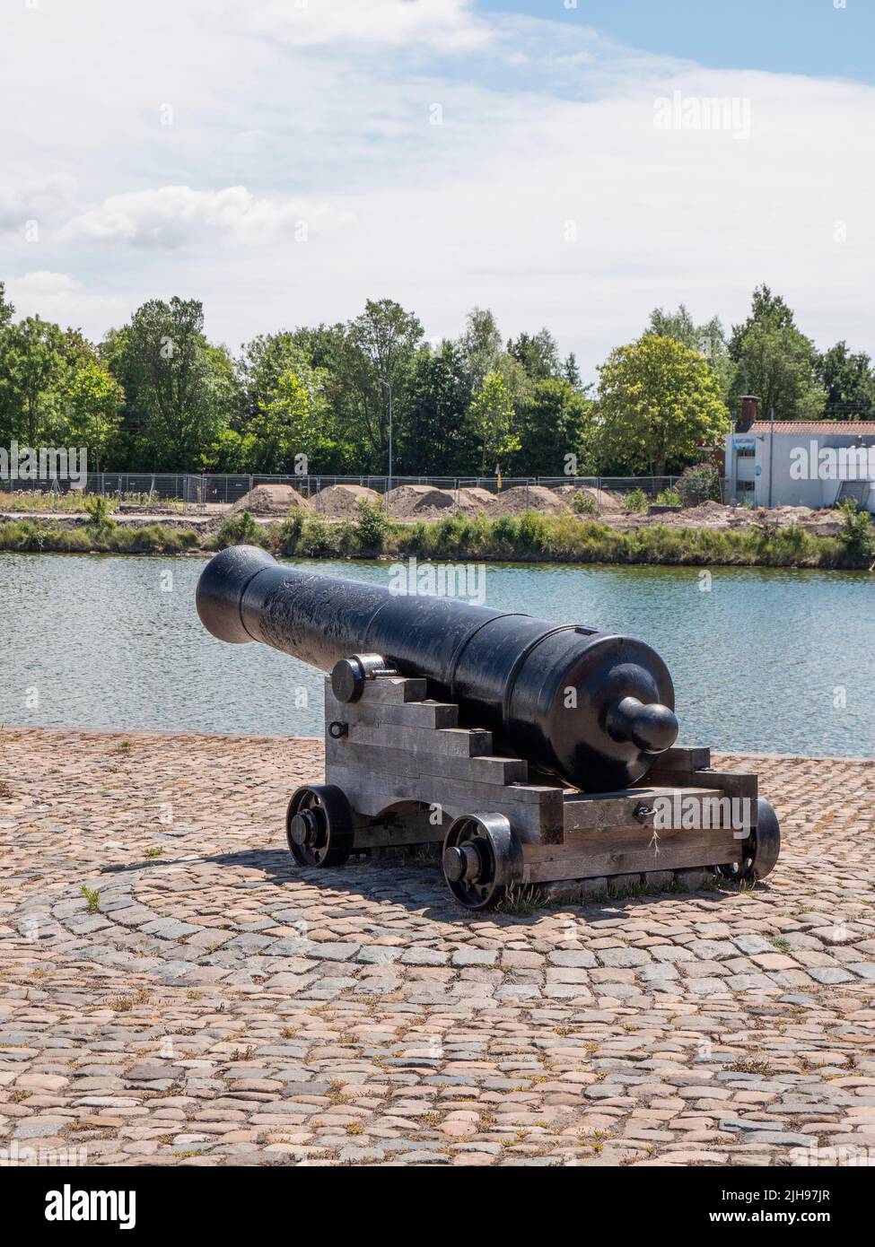 Middelburg, Netherlands, July 10, 2022, Old black cannon on the banks of the outer harbor Stock Photo