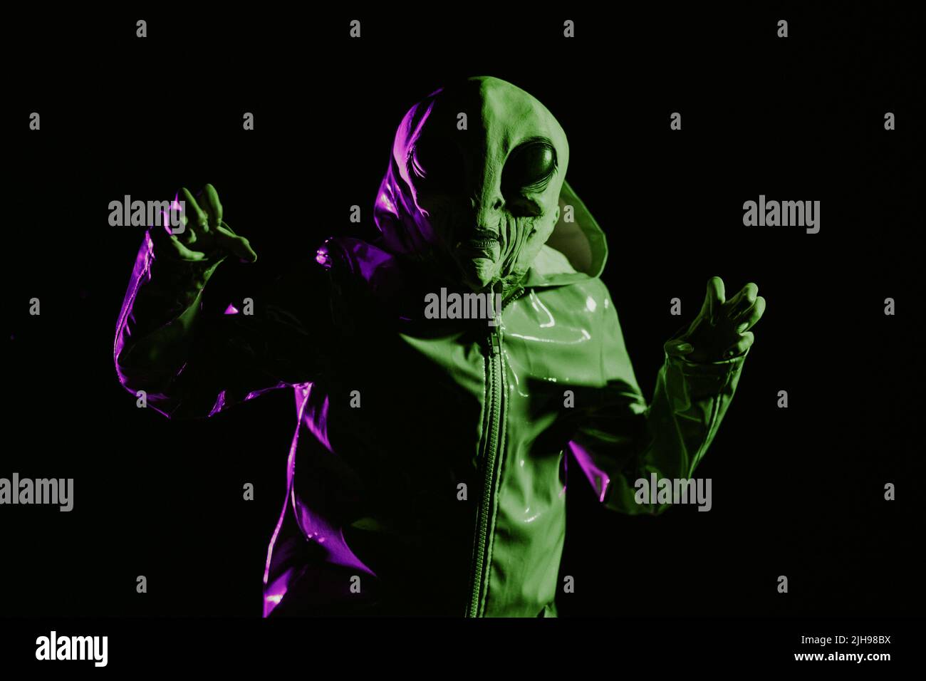 Futuristic alien showing frightening gesture, trying to scare. Creepy ...