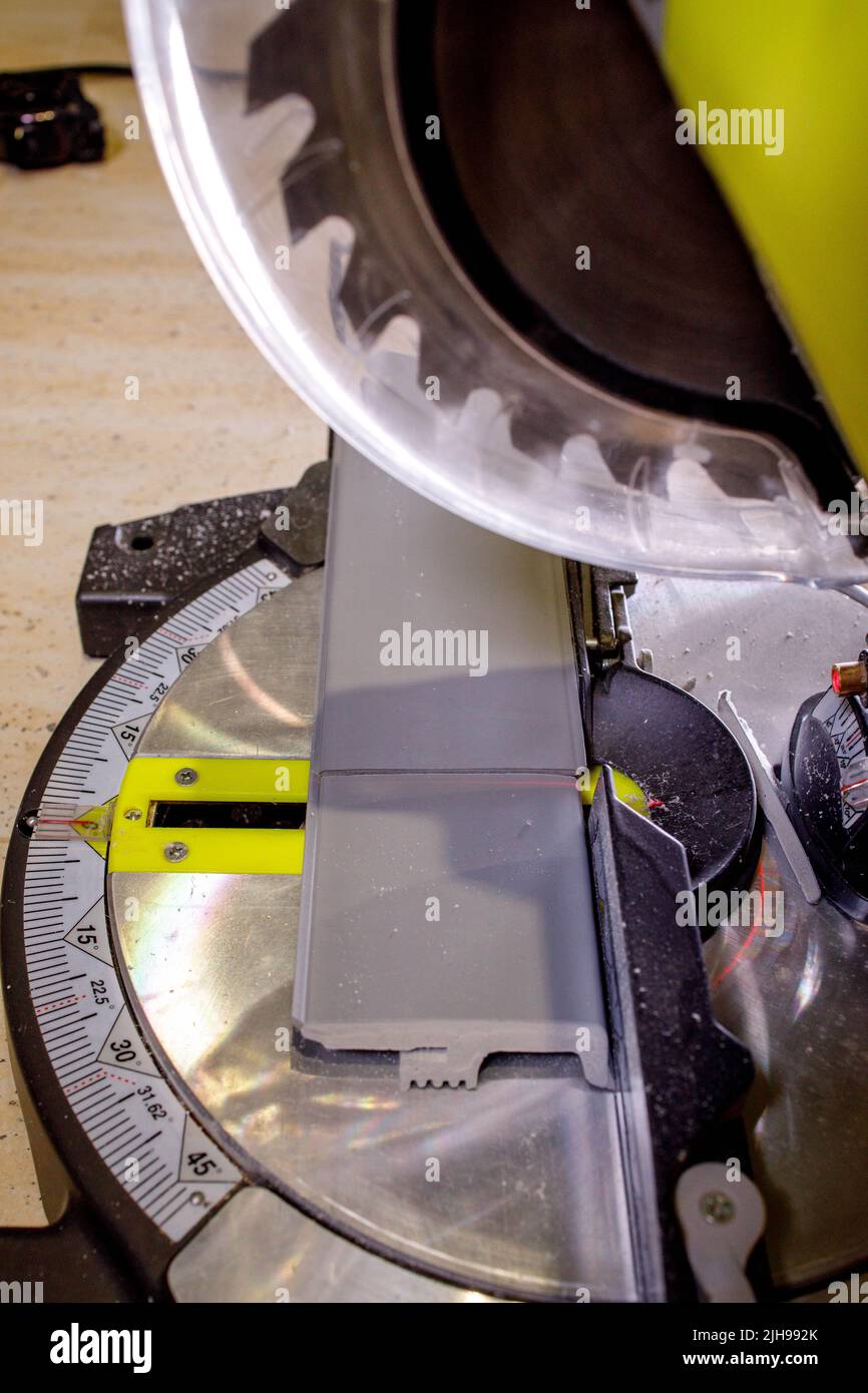 The circular saw cuts the plinth. Tool for repair work Stock Photo Alamy