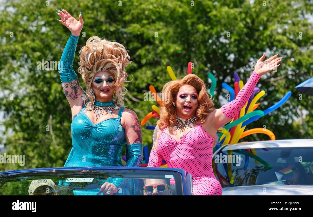 Halifax, Canada. July 16th, 2022. Participants in the 2022 Halifax Pride Parade wave to some of the thousands spectators that lined the course. The Parade returns through the street of the city after two years absence. Credit: meanderingemu /Alamy Live News Stock Photo
