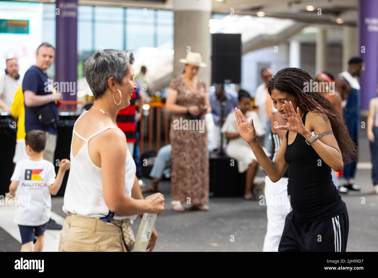 EDITORIAL USE ONLY Crowds dancing during the annual International Busking Day event at Wembley Park, London. Picture date: Saturday July 16, 2022. Stock Photo