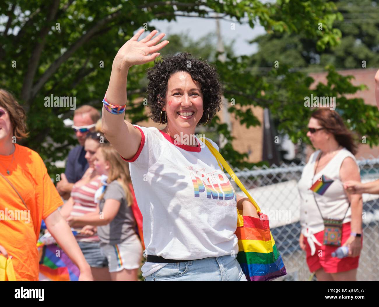 Halifax, Canada. July 16th, 2022. Newly elected NS NDP leader Claudia Chender waves to the crowd during the 2022 Halifax Parade. The Parade returns through the street of the city after two years absence. Credit: meanderingemu/Alamy Live News Stock Photo
