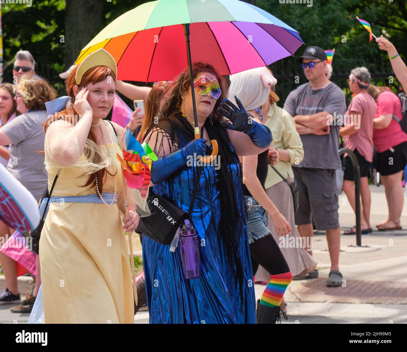 Halifax, Canada. July 16th, 2022. Participant in the 2022 Halifax Pride Parade waves to some of the thousands spectators that lined the course. The Parade returns through the street of the city after two years absence. Credit: meanderingemu/Alamy Live News Stock Photo