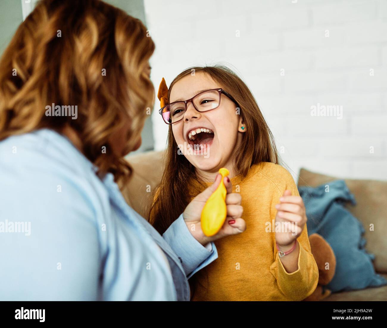 child daughter mother family happy playing kid childhood Stock Photo