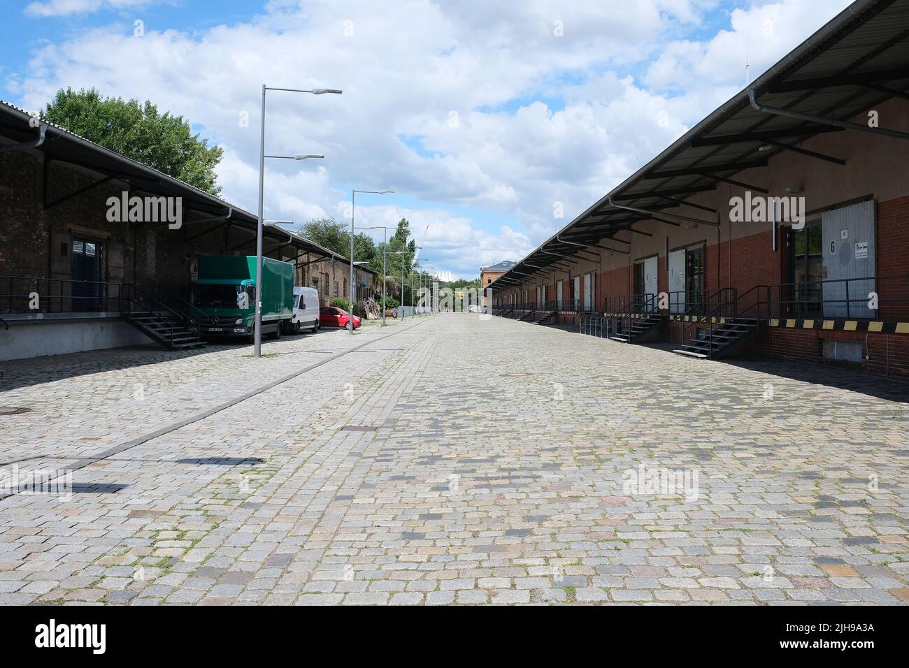 Berlin, Germany, July 11, 2022, freight station of the former Anhalter Bahnhof with peaks of the Tempodrom in the background Stock Photo