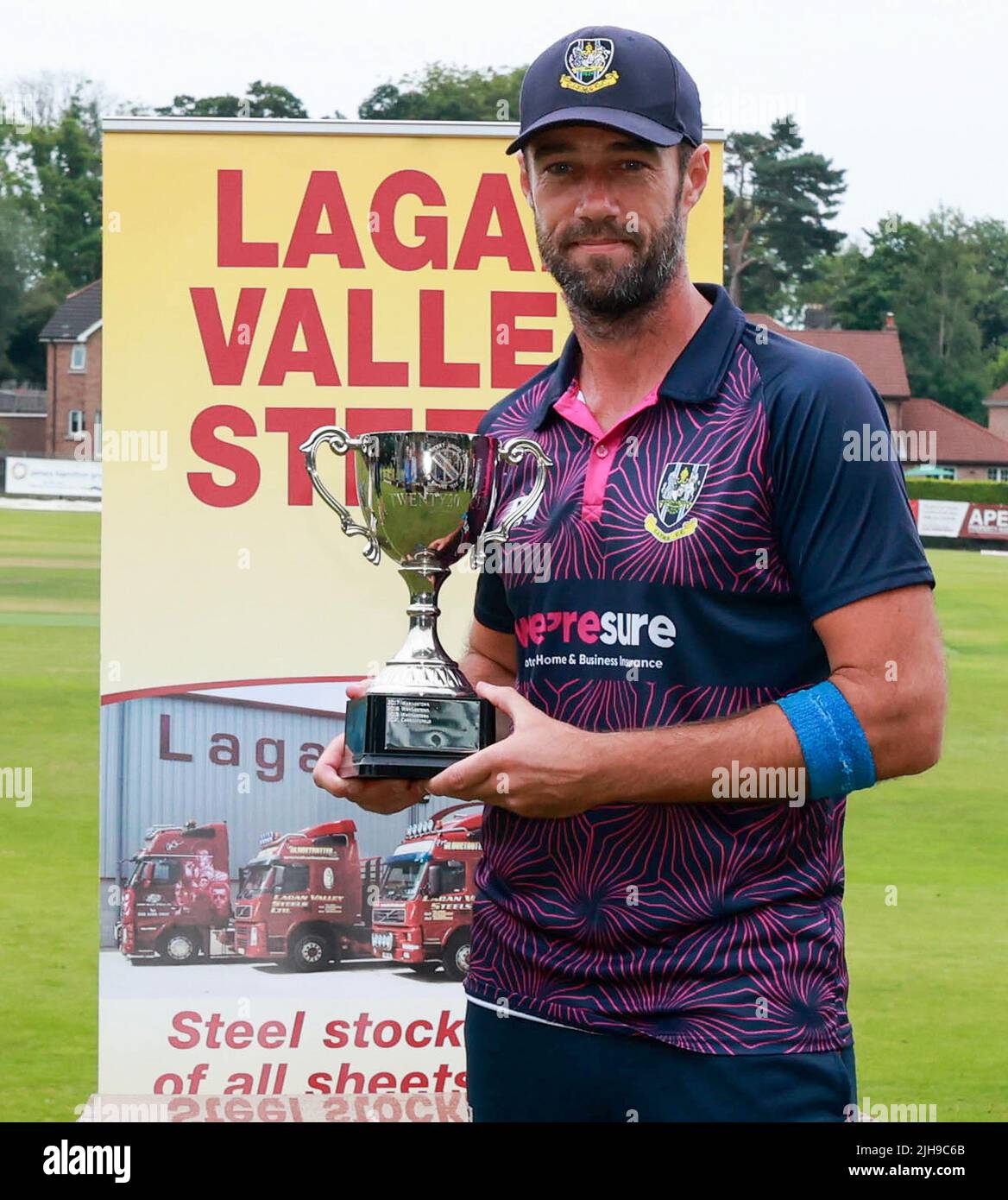 The Lawn, Waringstown, Northern Ireland, UK. 16 Jul 2022. The Lagan Valley Steels Twenty 20 Cup Final 2022. CIYMS v CSNI – CIYMS won by 16 runs (DLS) in a rain-affected match. CIYMD captain Nigel Jones with the Lagan Valley Steel T20 Cup. Credit: David Hunter/Alamy Live News Stock Photo