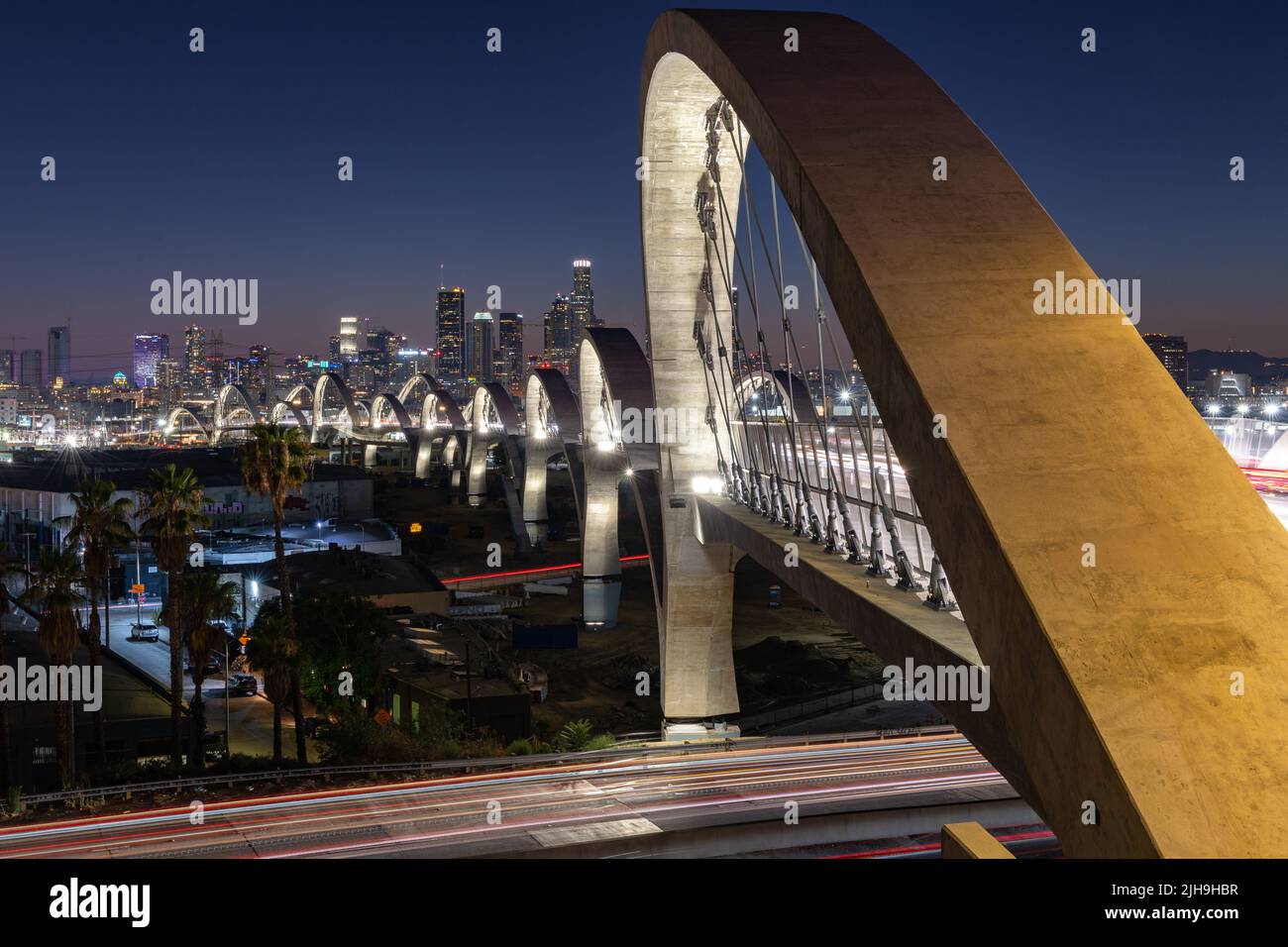 6th Street bridge in Los Angeles at sunset with the skyline in the