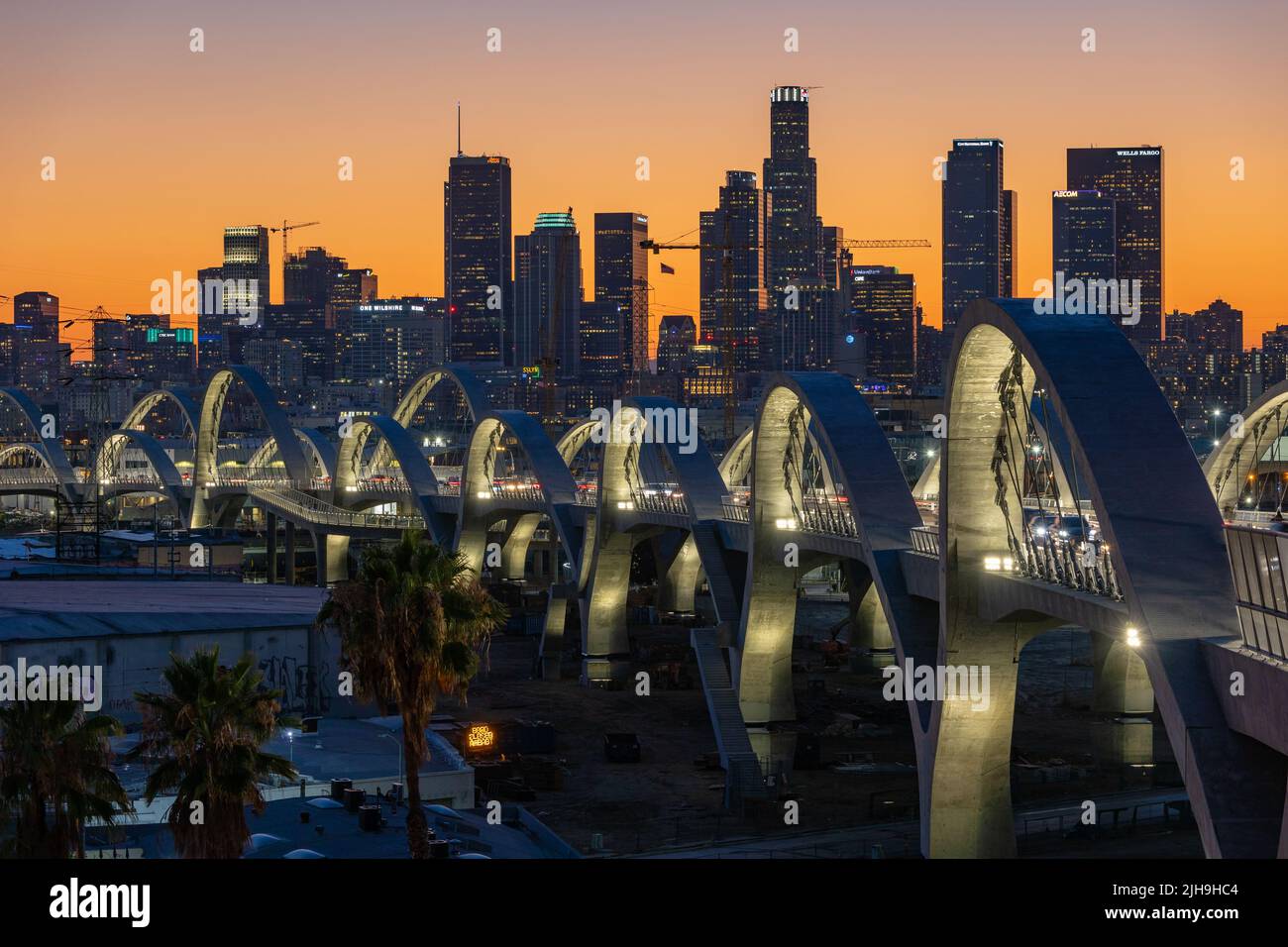6th Street bridge in Los Angeles at sunset with the skyline in the