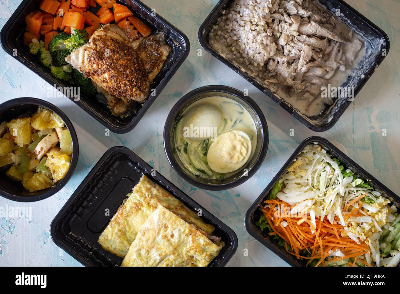 Healthy food in containers for the whole day. lunch and dinner on a ...