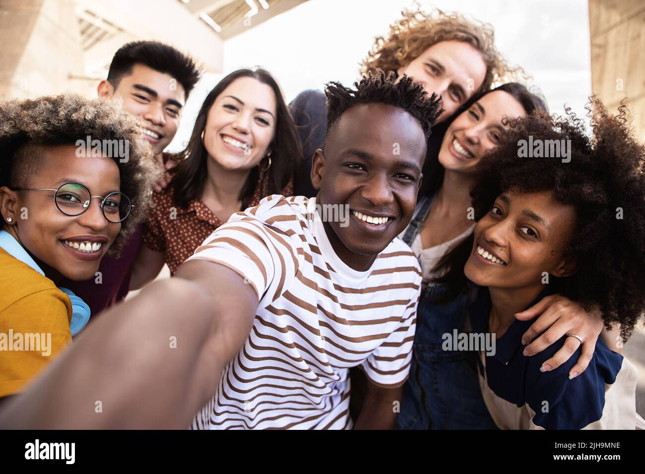 Group of happy young people taking selfie portrait together outdoor Stock Photo