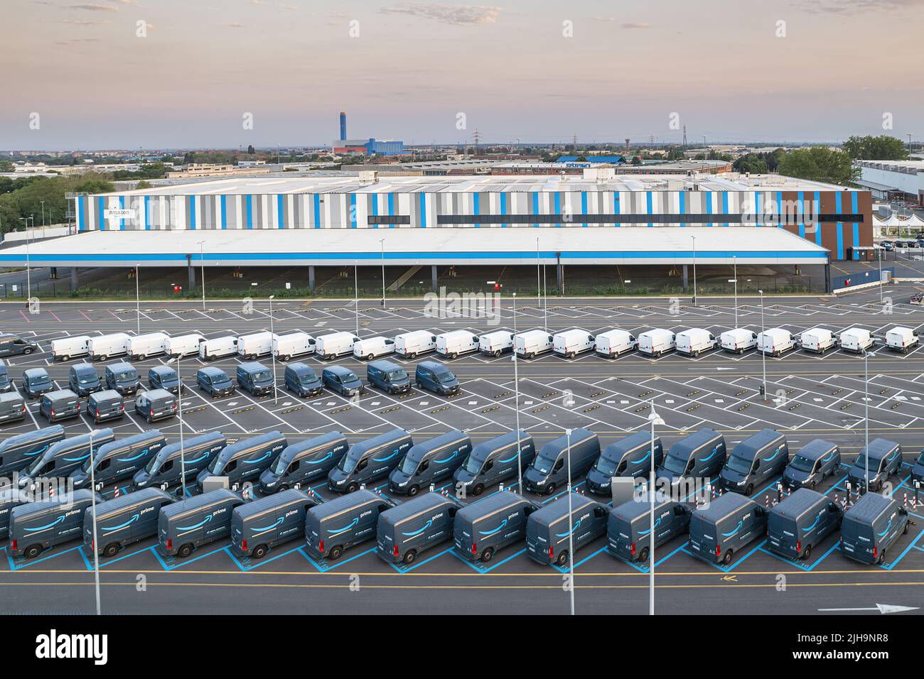 Top view of Amazon Prime electric delivery vans, parked at  the logistics hub of Amazon. Turin, Italy - July 2022 Stock Photo