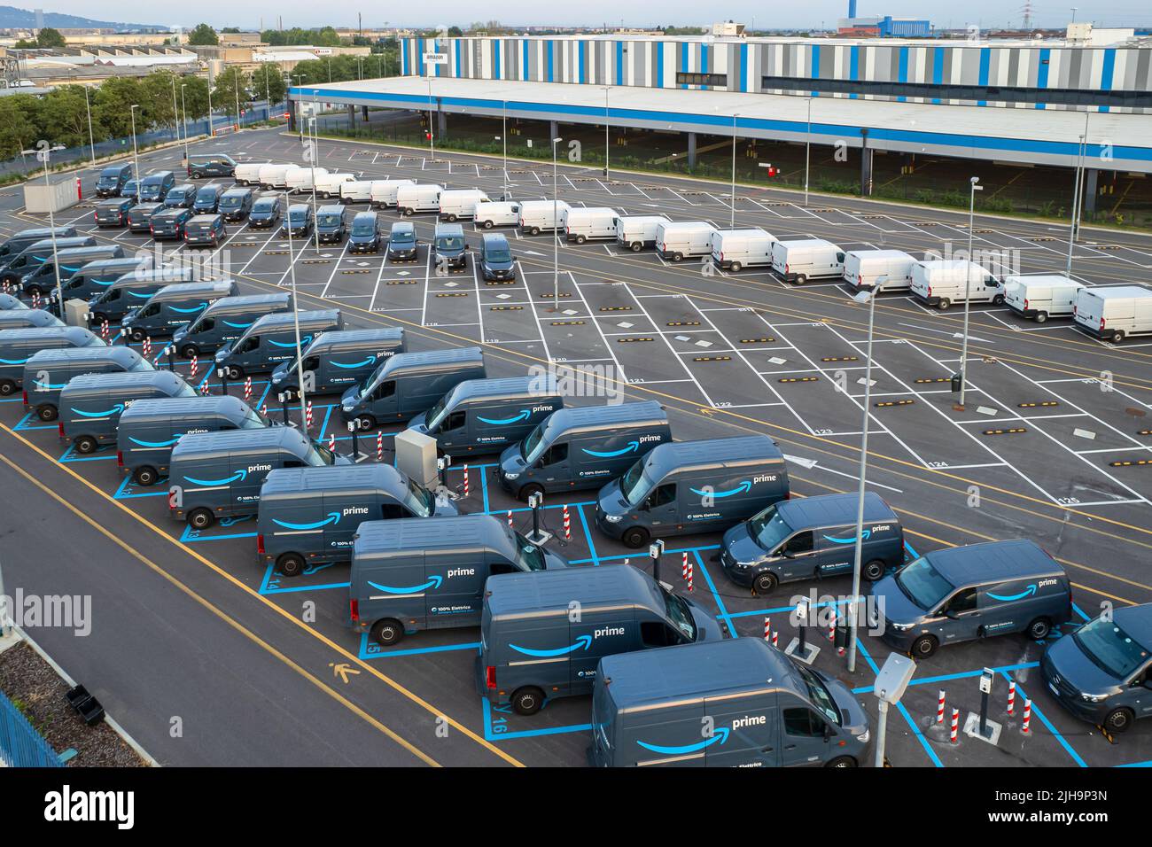 Top view of Amazon Prime electric delivery vans, parked at  the logistics hub of Amazon. Turin, Italy - July 2022 Stock Photo