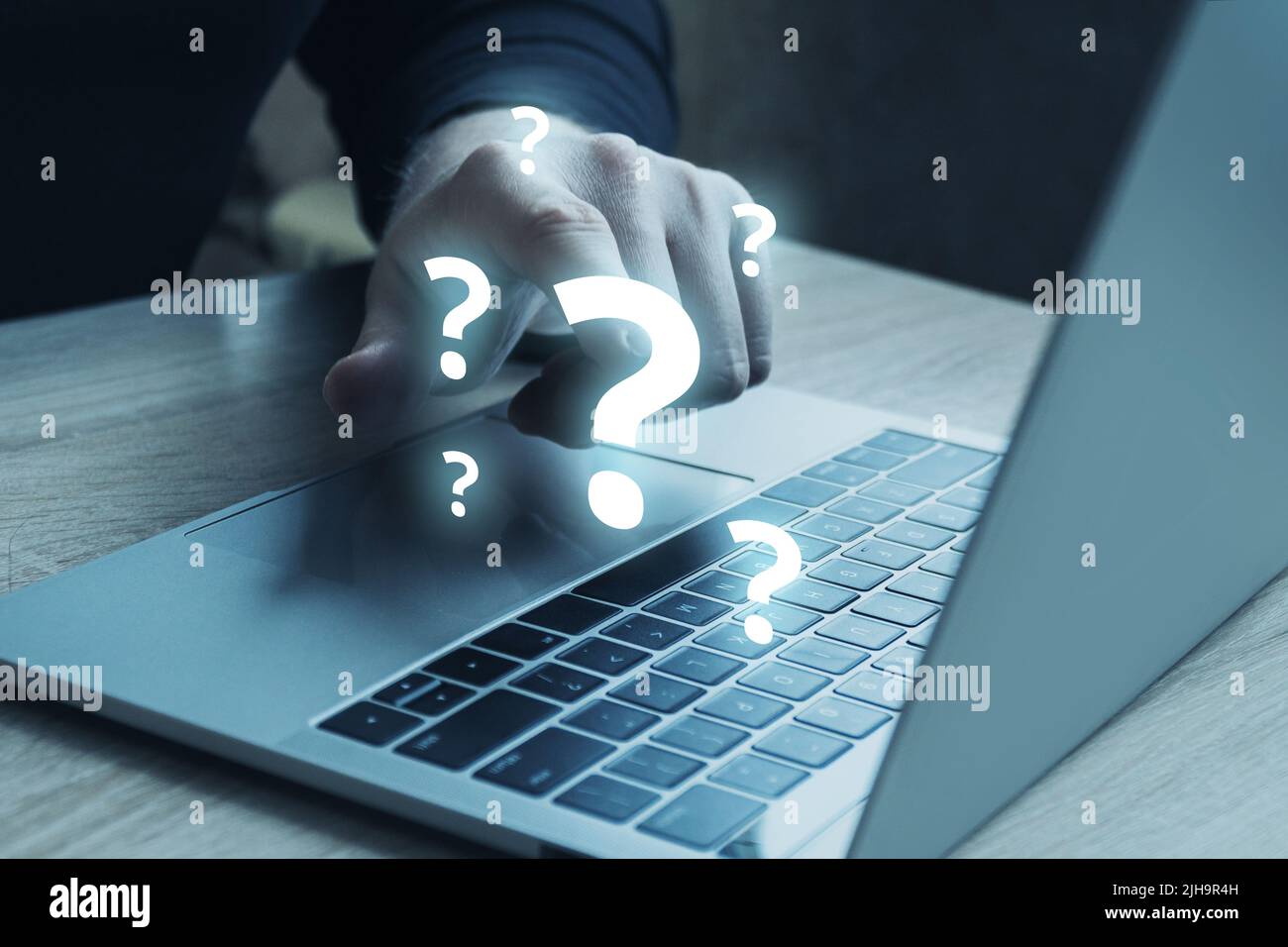 Question mark concept or FAQ. Person touches on a hologram next to a ...