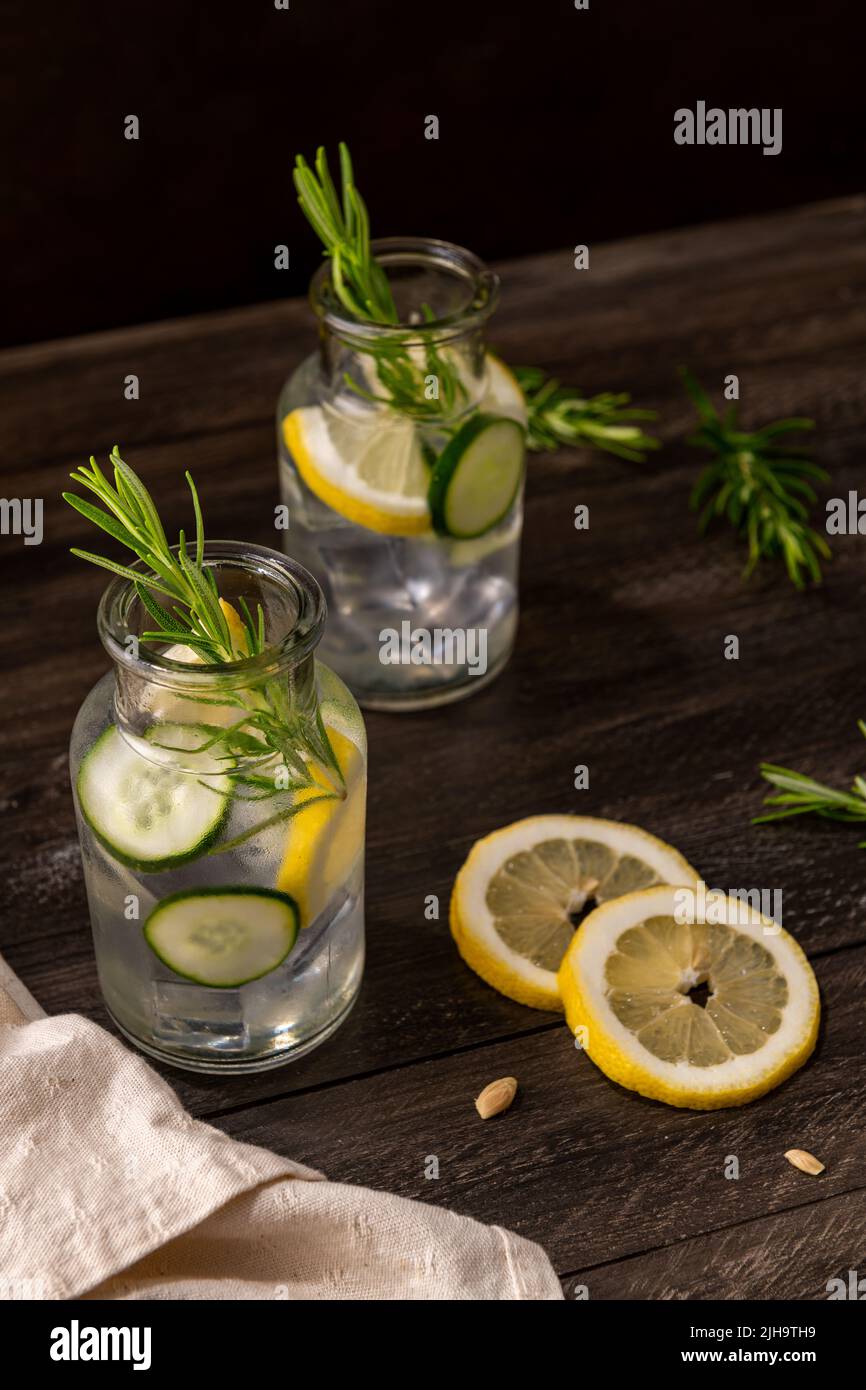 Water flavored with lemon, cucumber and rosemary leaves Stock Photo Alamy