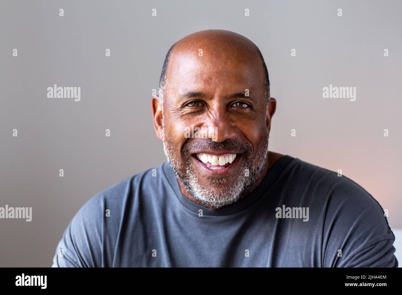 Happy attractive older African American man smiling. Stock Photo