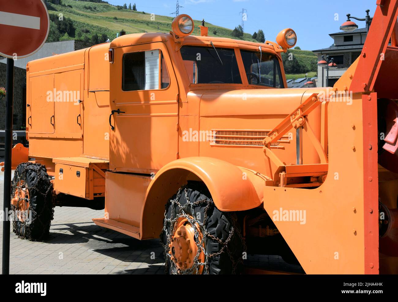 Old snowplow truck in the center of the town of Canillo located in the Pyrenees of the Principality of Andorra Stock Photo