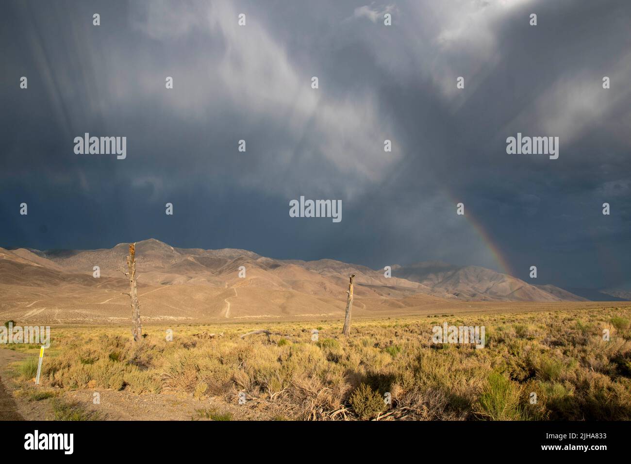 Thunderstorms around Bishop and the Eastern Sierra of California produce thunder, lightning, rainbows and dramatic skies. Stock Photo