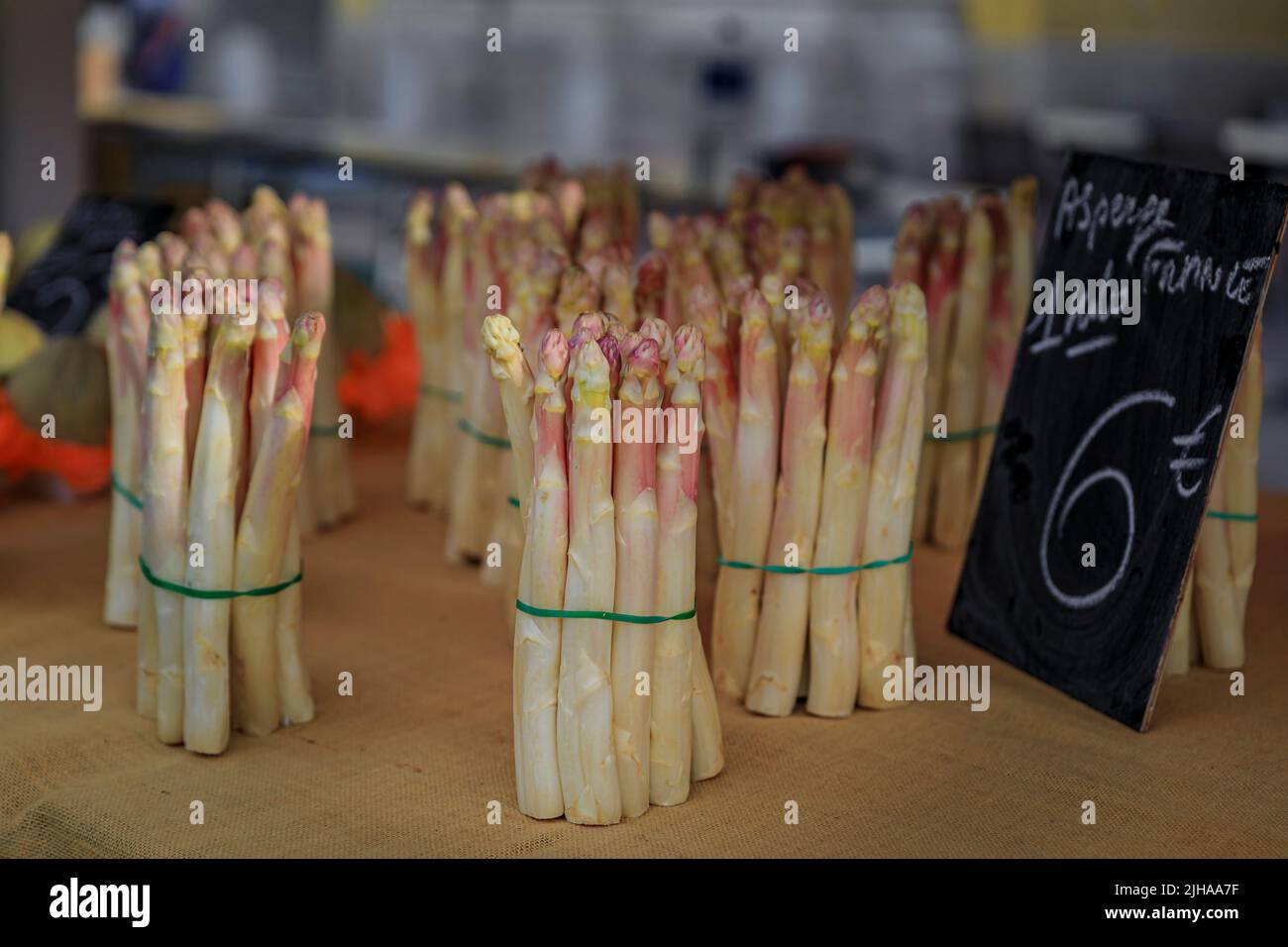Fresh locally grown white asparagus with a price tag of 6 Euro a kilo at a local farmers market Cours Saleya in the Old Town of Nice, South of France Stock Photo